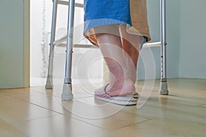 Elderly swollen feet or edema leg walk into bathroom