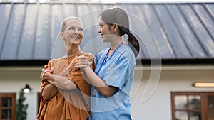 elderly touch hand on back of hand caregiver or nurses to express thankful