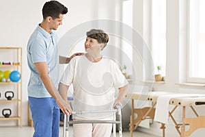 Elderly ward using walking frame