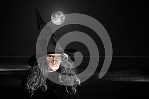 Elderly Witch In Black Hat - Waves & Full Moon