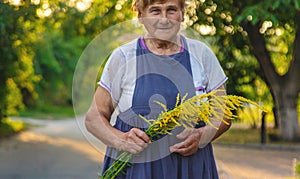 An elderly woman is allergic to ragweed. selective focus.
