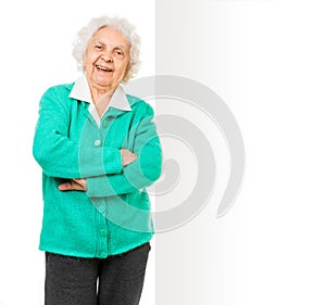 Elderly woman alongside of ad board