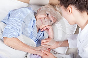 Elderly woman in bed