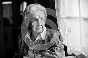 An elderly woman black and white portrait. Grandmother.