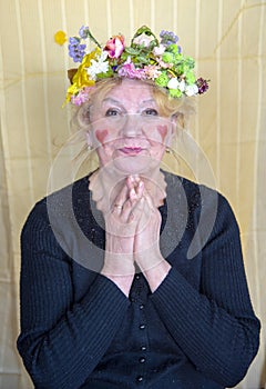 An elderly woman with bright funny makeup