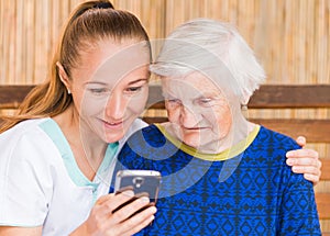 Elderly woman with caregiver