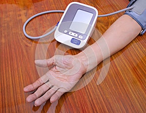 Elderly woman check blood pressure.and heart rate with digital pressure measuring. Happy aging and Medical concept