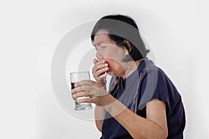 Elderly woman Choking a water drink