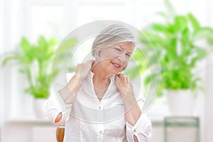 Senior woman acute shoulder pain photo