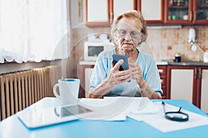 Elderly woman contacting custumer services after recieving a bill