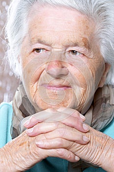 Elderly woman contemplating