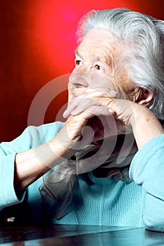 Elderly woman contemplating