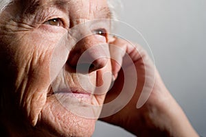 Elderly woman contemplating