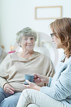 Elderly woman during conversation
