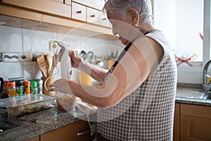 Elderly woman cooking