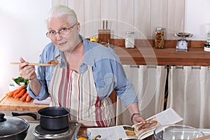 Elderly woman cooking dinner