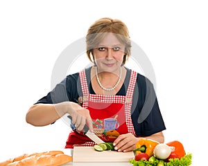 Elderly woman cooks food