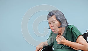 Elderly woman cough ,choke on wheelchair