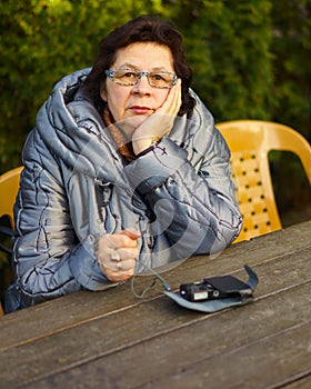 Elderly woman deep in thought