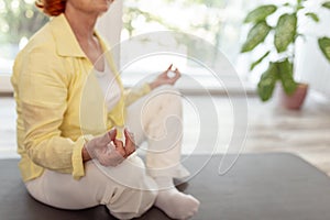 Elderly woman doing meditation session