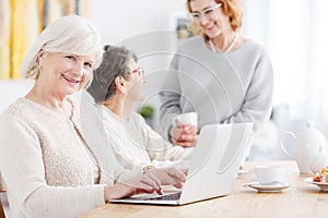 Elderly woman doing online shopping