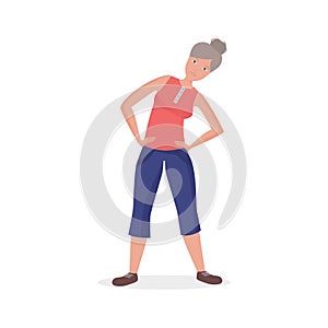 Elderly woman doing sports exercise, bending for back health photo