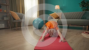 Elderly woman doing stretching after a workout. A woman does an exercise for her back and spine. Keeping body in tone.