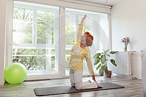 Elderly woman doing yoga