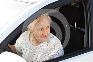 Elderly woman driving car