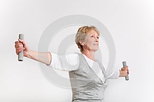 Elderly woman with a dumbells