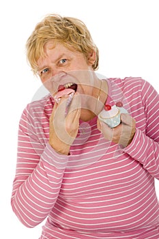 Elderly woman is eating