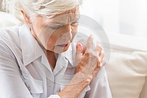 Elderly woman is enduring awful ache