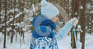 An elderly woman enjoys a short ride on classic bicycles through the forest