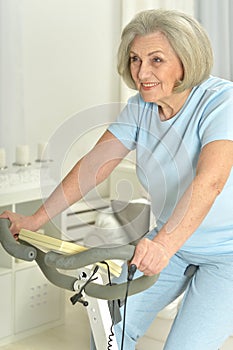 Elderly woman exercising on an exercise bike