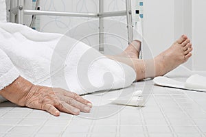 Elderly woman falling in bathroom