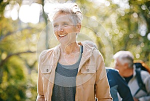 Elderly woman, fitness and hiking in park, happy with freedom outdoor and exercise with active lifestyle and wellness