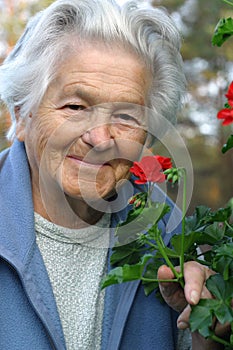 Elderly woman and flowers