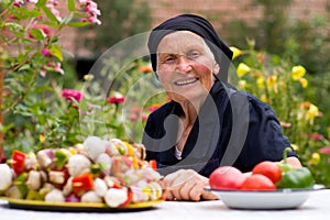 Elderly woman with fresh food