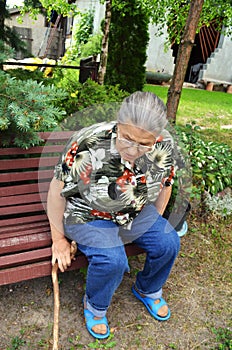 An elderly woman in the garden