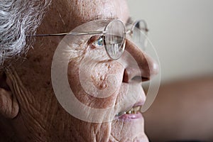 Elderly woman gazing and smiling from side