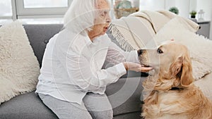 Elderly woman with golden retriever dog