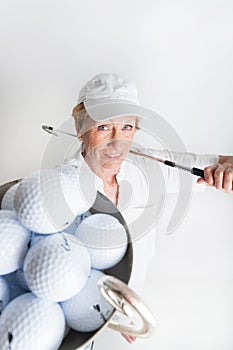 Elderly woman with a golf trophy