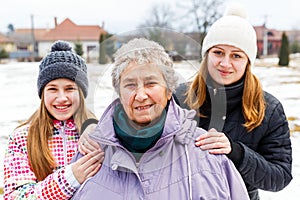 Elderly woman and granddaughters