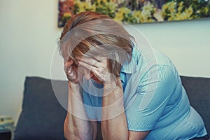 Elderly woman in grief