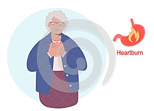 Elderly woman having a heartburn or stomach problem and suffering for this
