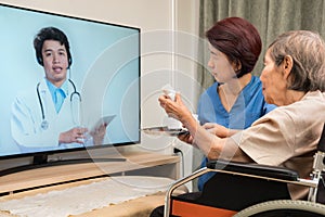 Elderly woman having online consultation with doctor