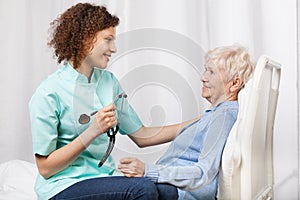 Elderly woman and her nurse