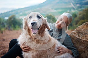 Elderly woman, hiking with dog in forest and adventure, fitness with travel and pet with love and care. Nature, trekking