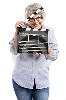 Elderly woman holding a clapboard