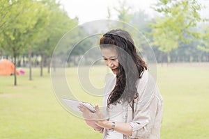 Elderly woman holding a Tablet